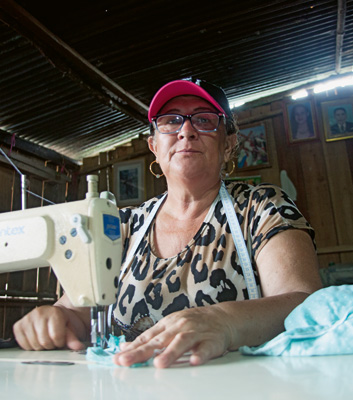 Indefatigable: María Leíver Urrego, herself a victim of the conflict, works on behalf of IDPs. She spends her evenings sewing clothes for a small income